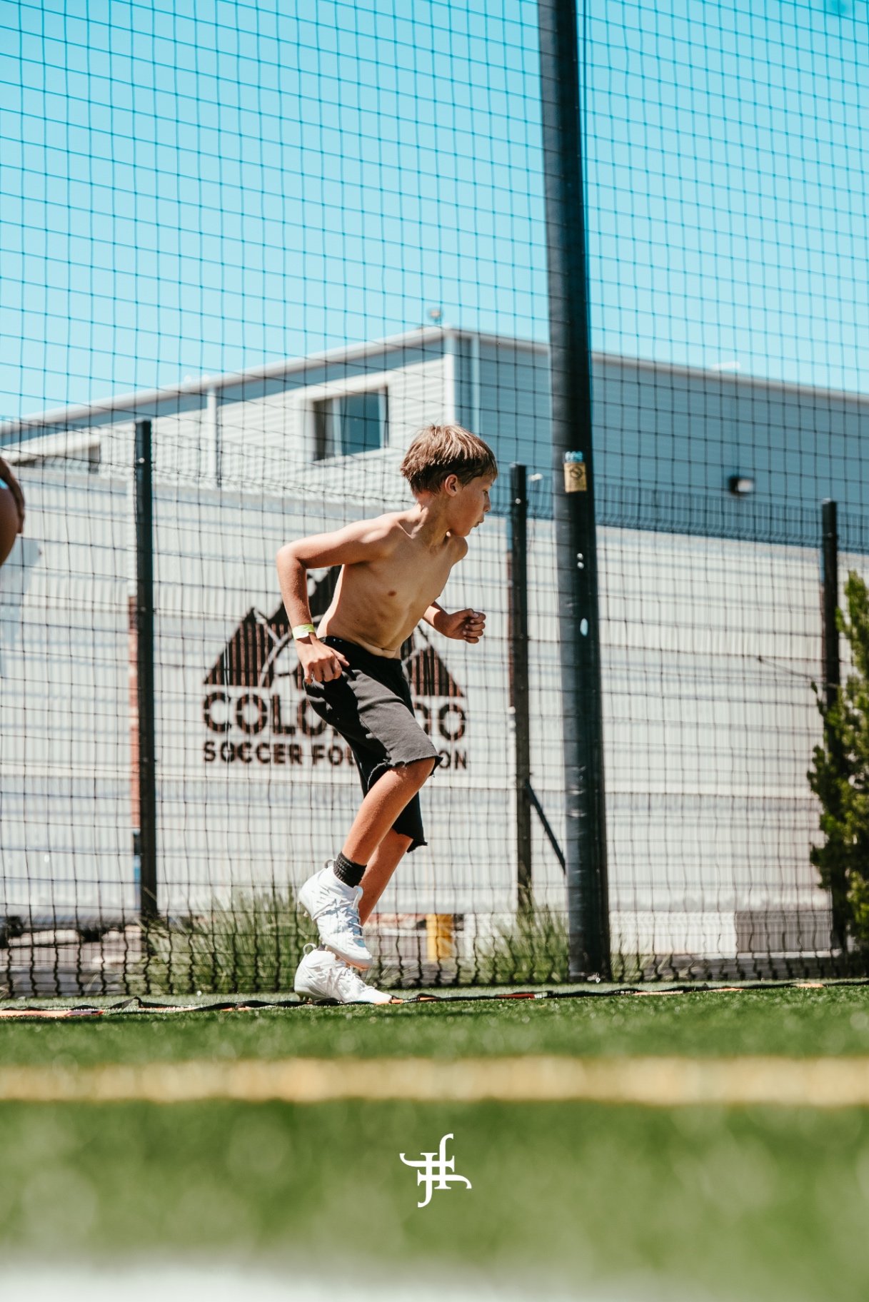 Camper running the ladder drill